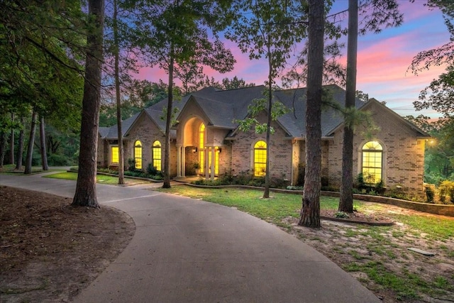 view of front of home with a lawn