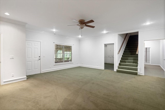 unfurnished living room featuring ceiling fan, dark carpet, and crown molding