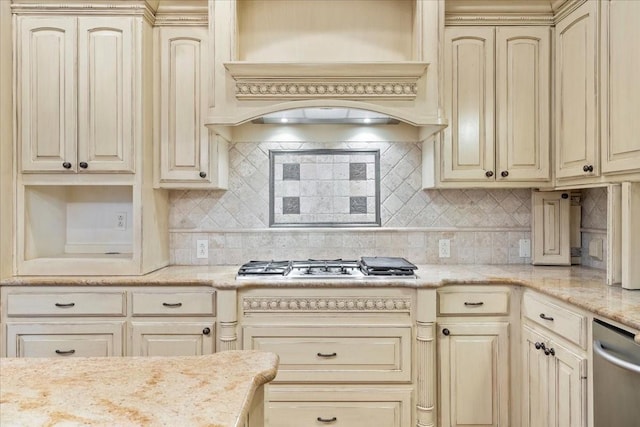 kitchen featuring decorative backsplash, cream cabinets, and custom exhaust hood