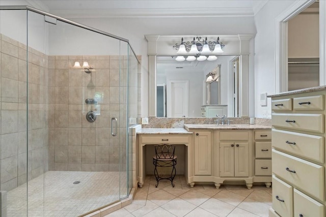 bathroom featuring tile patterned flooring, vanity, a shower with door, and crown molding