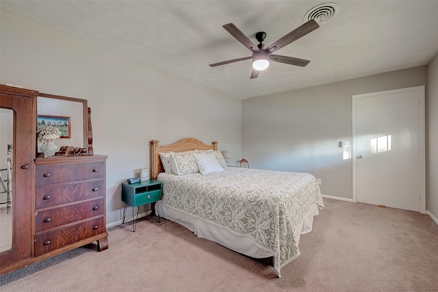 bedroom featuring ceiling fan and light colored carpet