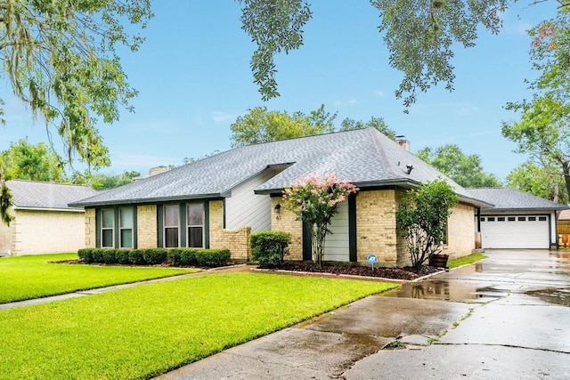 ranch-style home with a garage and a front lawn