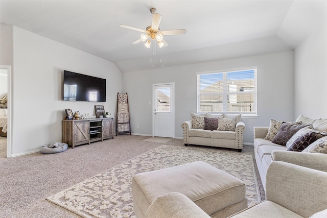 living room with ceiling fan, light carpet, and vaulted ceiling