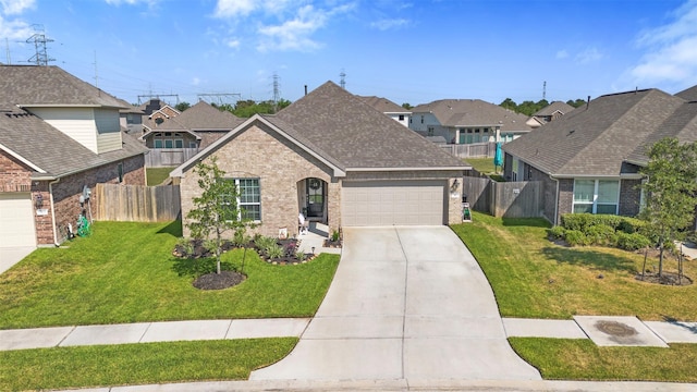 view of front facade with a front yard and a garage