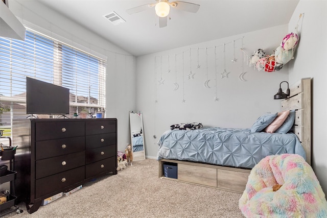 bedroom with ceiling fan, light colored carpet, and lofted ceiling