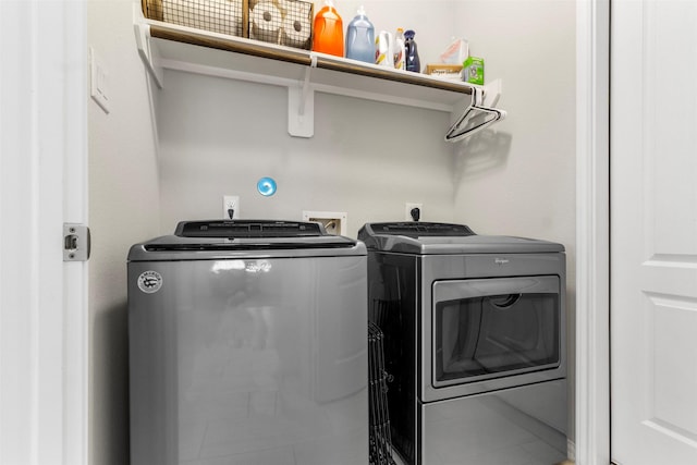 washroom with separate washer and dryer