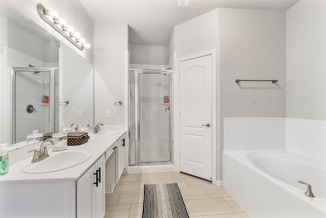 bathroom featuring separate shower and tub, tile patterned flooring, and vanity