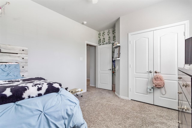 carpeted bedroom with a closet