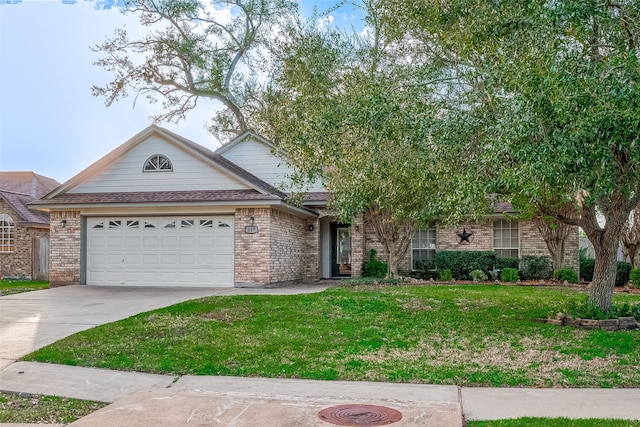 view of front of home with a front yard and a garage