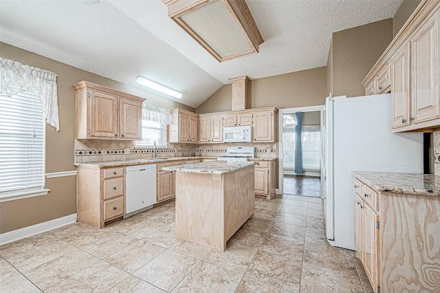 kitchen featuring vaulted ceiling, backsplash, a center island, white appliances, and light brown cabinetry