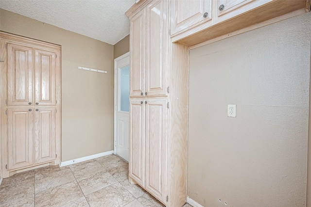 interior space with a textured ceiling