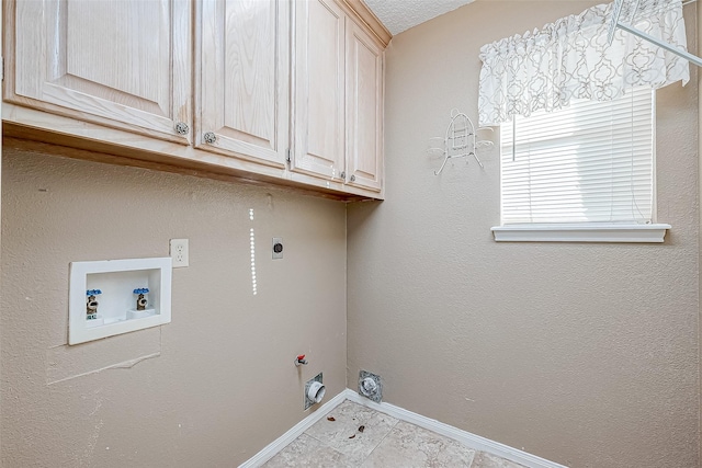 washroom featuring cabinets, washer hookup, electric dryer hookup, and hookup for a gas dryer