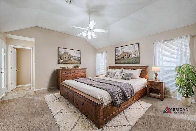 bedroom with ceiling fan, lofted ceiling, and light colored carpet