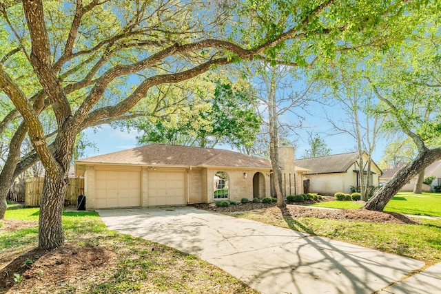 ranch-style house featuring a front yard and a garage