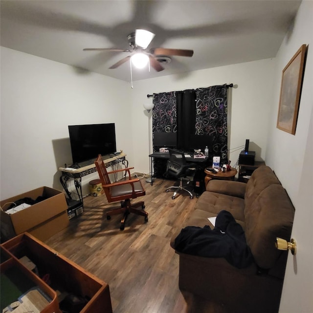 home office with hardwood / wood-style flooring and ceiling fan