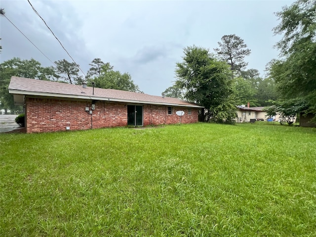903 US Highway 190 W, Jasper, TX 75951 - back of property featuring a yard and brick siding