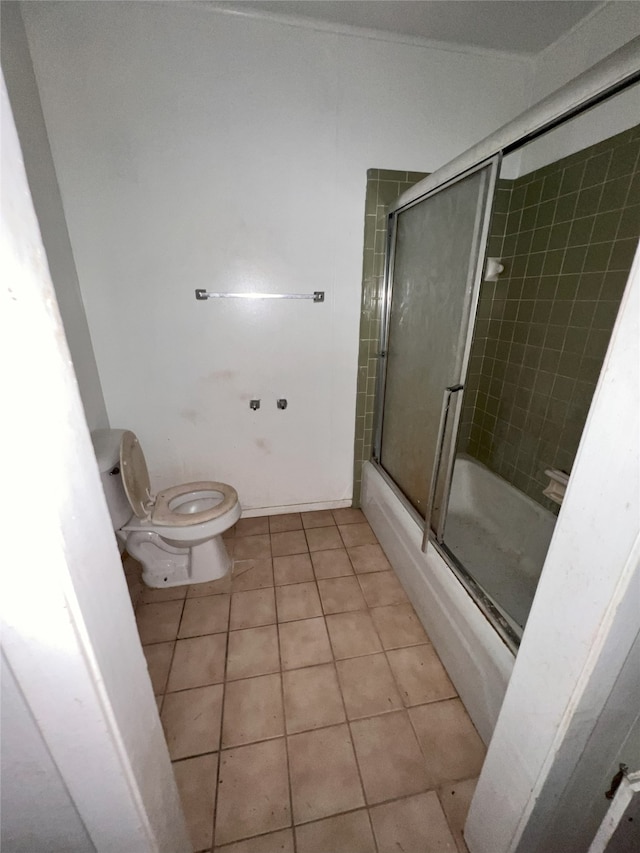 903 US Highway 190 W, Jasper, TX 75951 - bathroom featuring tile patterned floors, shower / bath combination with glass door, and toilet