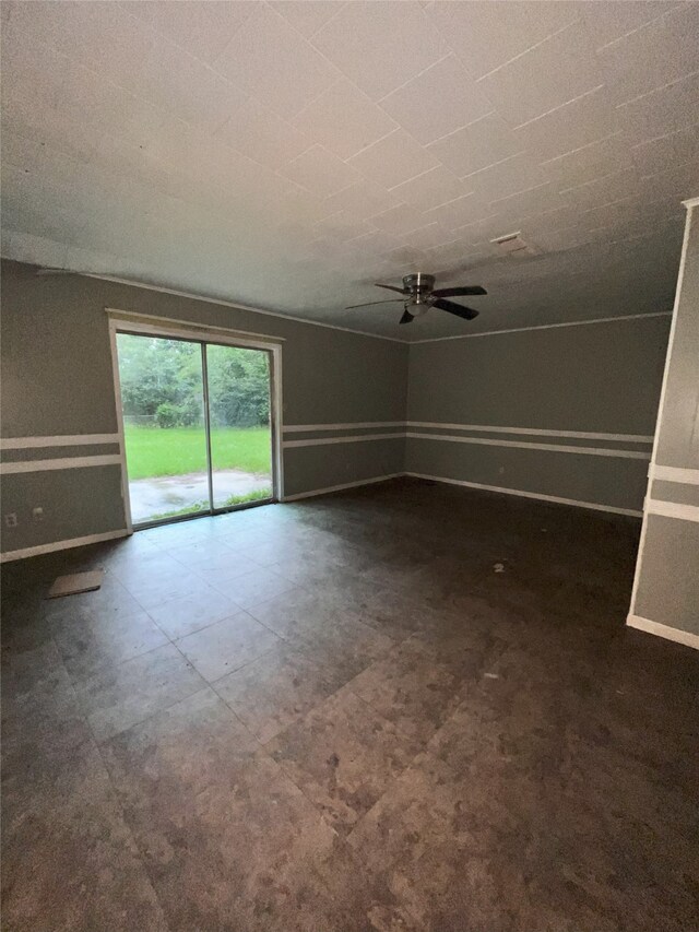 903 US Highway 190 W, Jasper, TX 75951 - unfurnished living room featuring baseboards and a ceiling fan