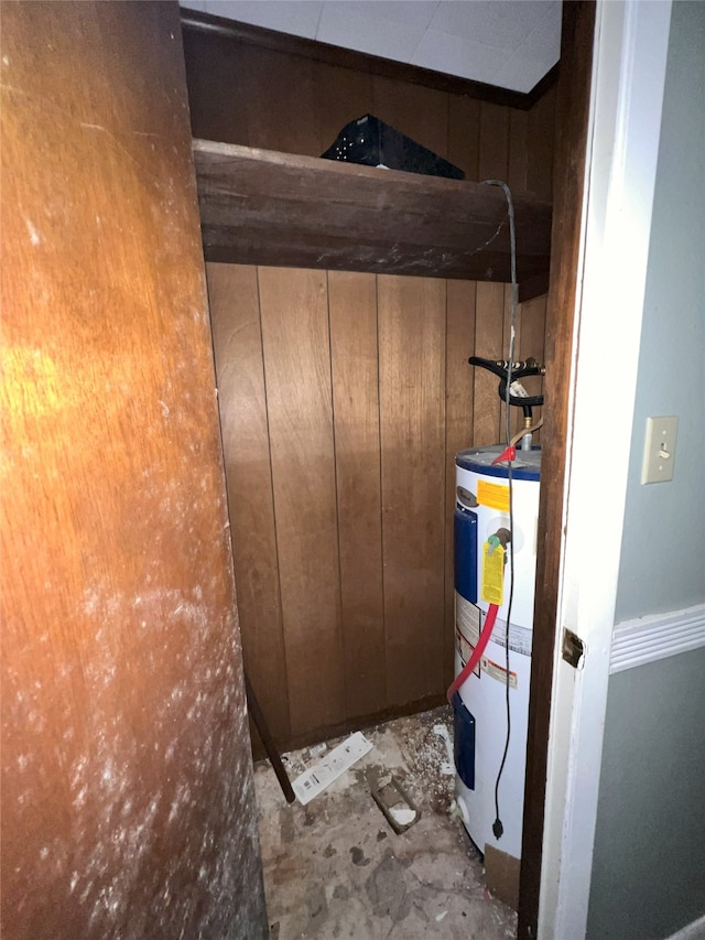 903 US Highway 190 W, Jasper, TX 75951 - detailed view of water heater, wooden walls, and unfinished concrete floors