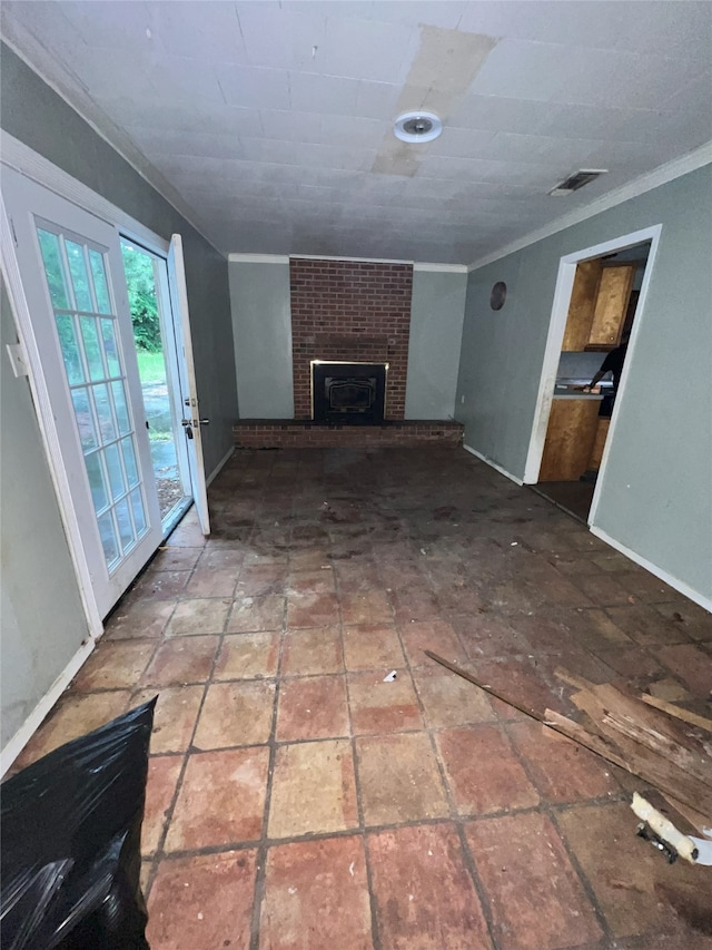 903 US Highway 190 W, Jasper, TX 75951 - unfurnished living room featuring a brick fireplace, ornamental molding, and baseboards