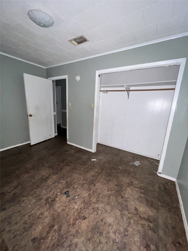 903 US Highway 190 W, Jasper, TX 75951 - unfurnished bedroom with crown molding, a closet, and baseboards