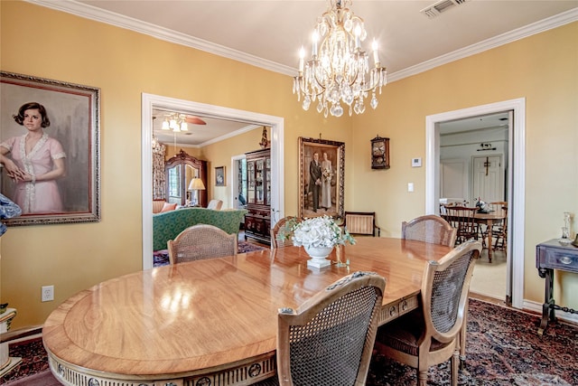 dining room featuring crown molding and ceiling fan with notable chandelier