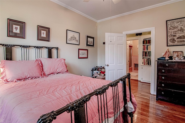 bedroom with ceiling fan, hardwood / wood-style flooring, and ornamental molding