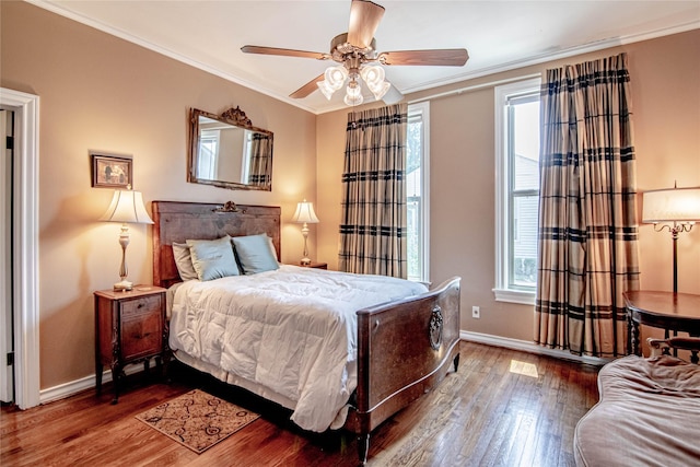 bedroom with hardwood / wood-style floors, ceiling fan, and crown molding