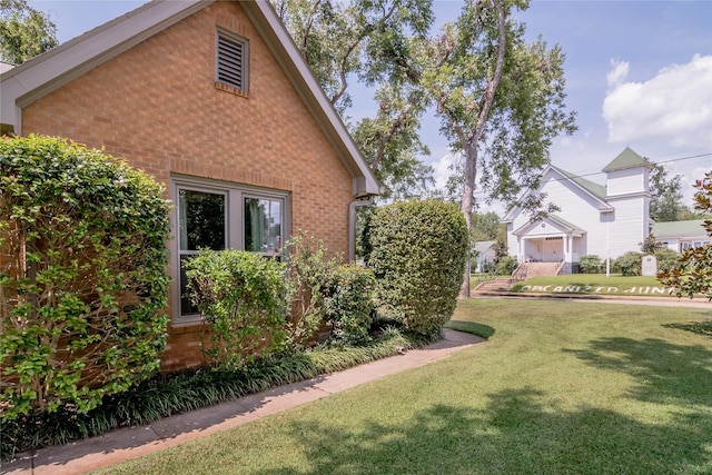 view of home's exterior featuring a yard