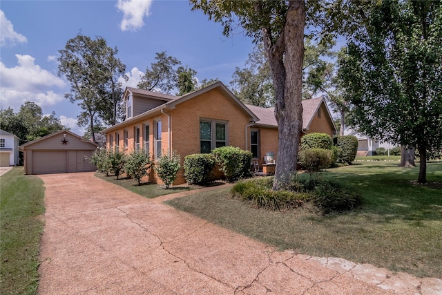 view of front facade featuring a garage, an outdoor structure, and a front lawn