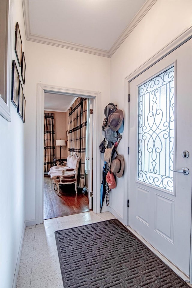 foyer entrance with a wealth of natural light and crown molding