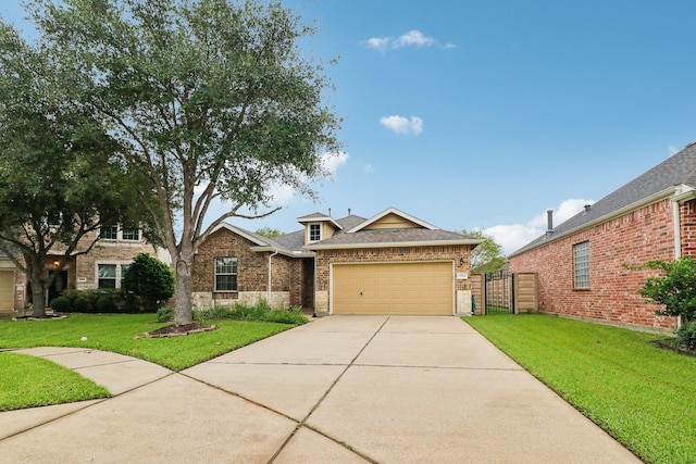 view of front of home with a garage and a front yard