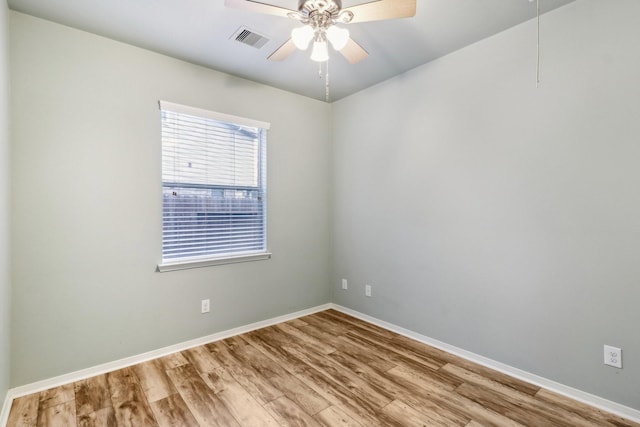 unfurnished room with ceiling fan and light wood-type flooring