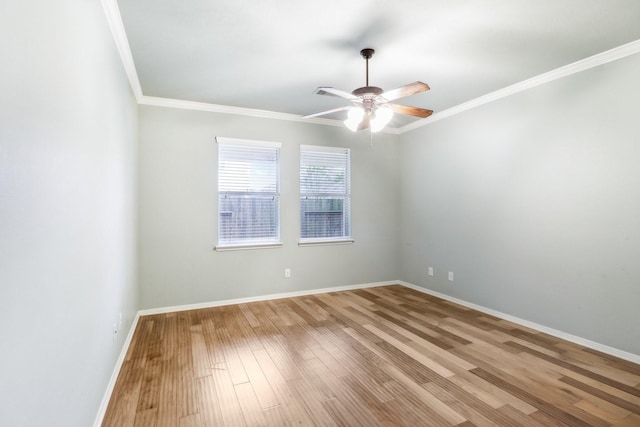 spare room featuring ceiling fan, light wood-type flooring, and ornamental molding