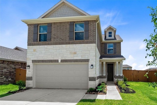 2836 Shimmer Edge Dr, Katy, TX 77493 - view of front of home featuring fence, a front yard, stone siding, an attached garage, and driveway
