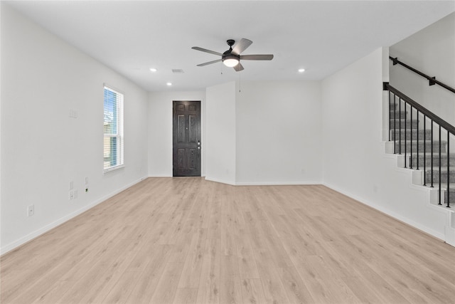 2836 Shimmer Edge Dr, Katy, TX 77493 - unfurnished living room featuring light wood-style floors, recessed lighting, stairs, and ceiling fan
