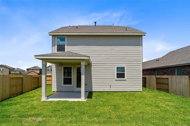 2836 Shimmer Edge Dr, Katy, TX 77493 - rear view of property featuring a fenced backyard, a patio, and a lawn
