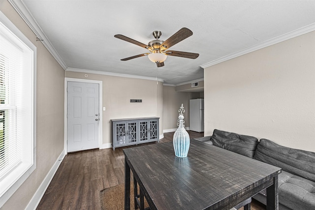 dining room featuring crown molding, dark hardwood / wood-style flooring, and ceiling fan