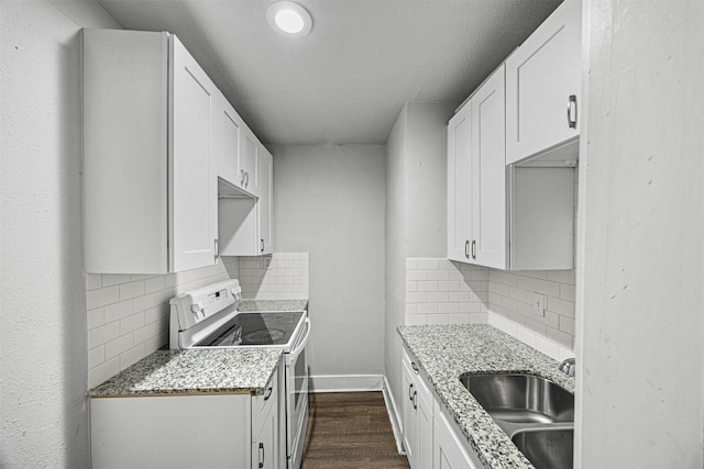 kitchen with white cabinets, white electric range, and sink