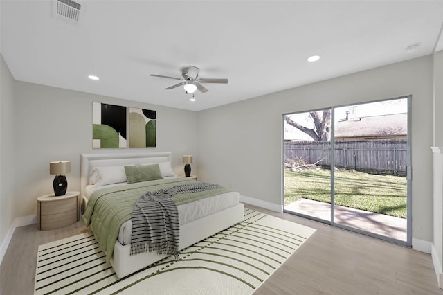 bedroom with access to exterior, light hardwood / wood-style floors, and ceiling fan