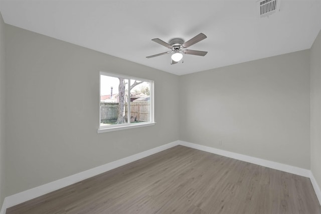 unfurnished room featuring ceiling fan and light hardwood / wood-style flooring