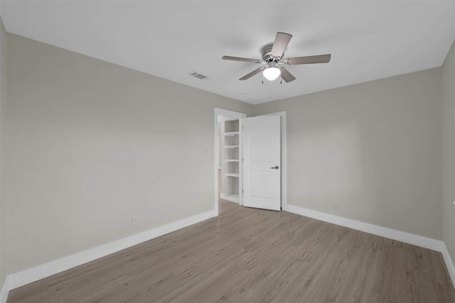 unfurnished room featuring ceiling fan and light hardwood / wood-style flooring