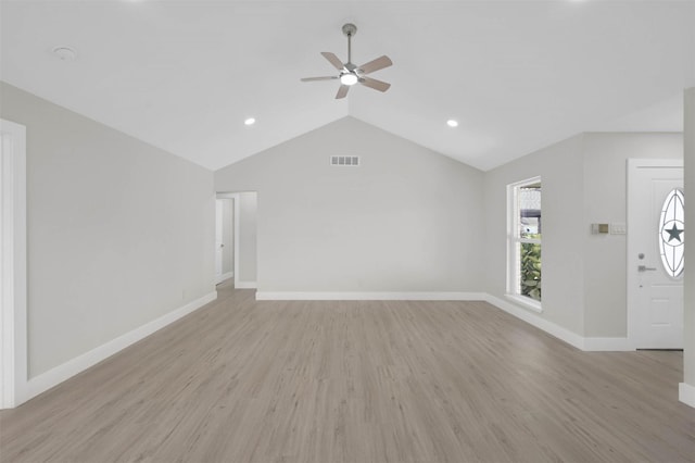 unfurnished living room with vaulted ceiling, light hardwood / wood-style flooring, and ceiling fan