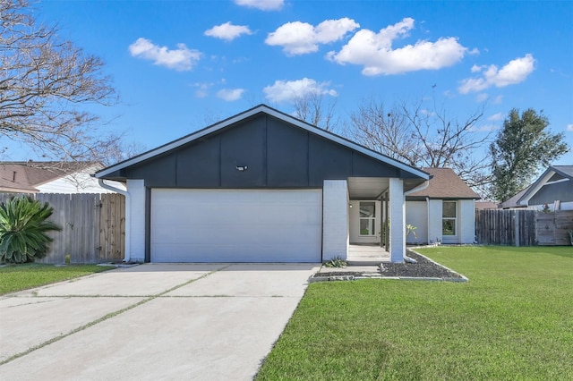 ranch-style home featuring a garage and a front lawn