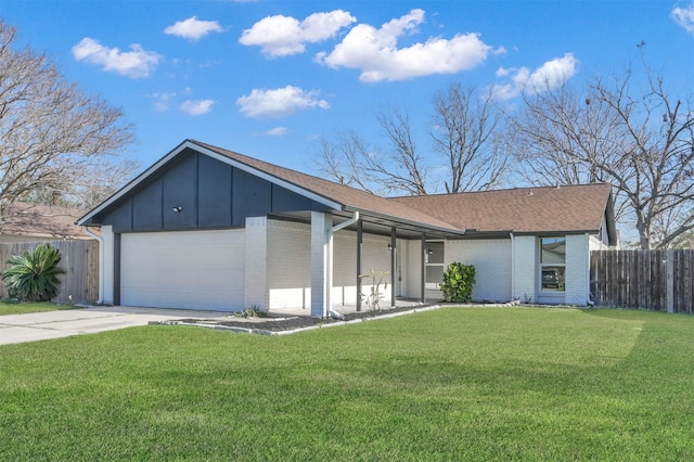 ranch-style home featuring a garage and a front yard