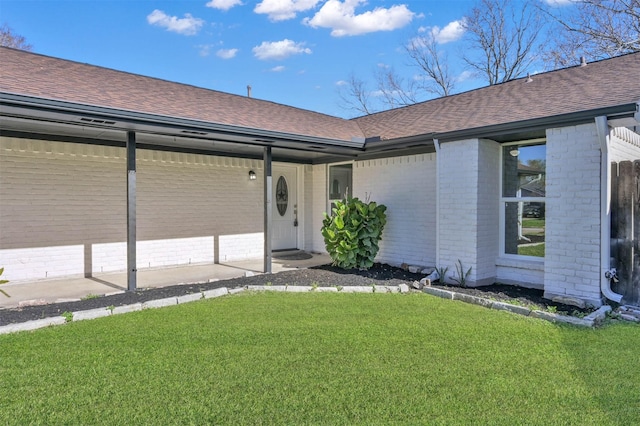 property entrance with a yard