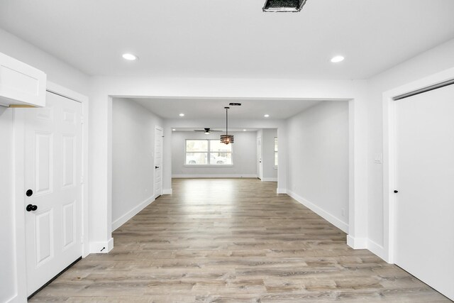 corridor featuring light hardwood / wood-style floors