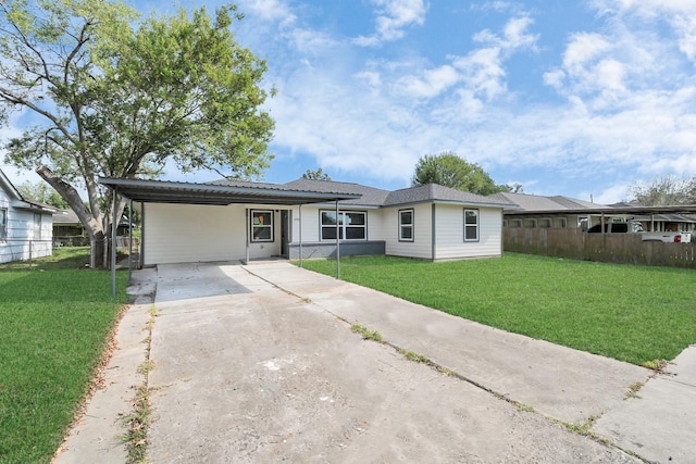 single story home with a front lawn and a carport