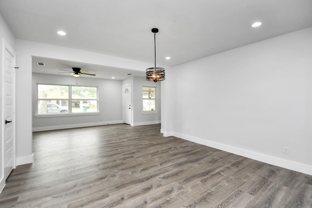 unfurnished room featuring ceiling fan and wood-type flooring