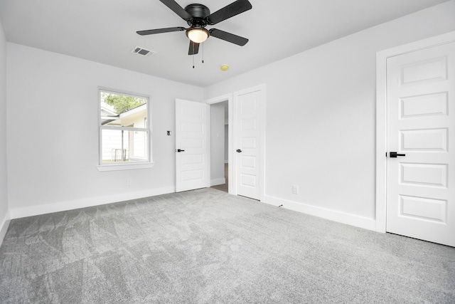 unfurnished bedroom with ceiling fan and carpet floors